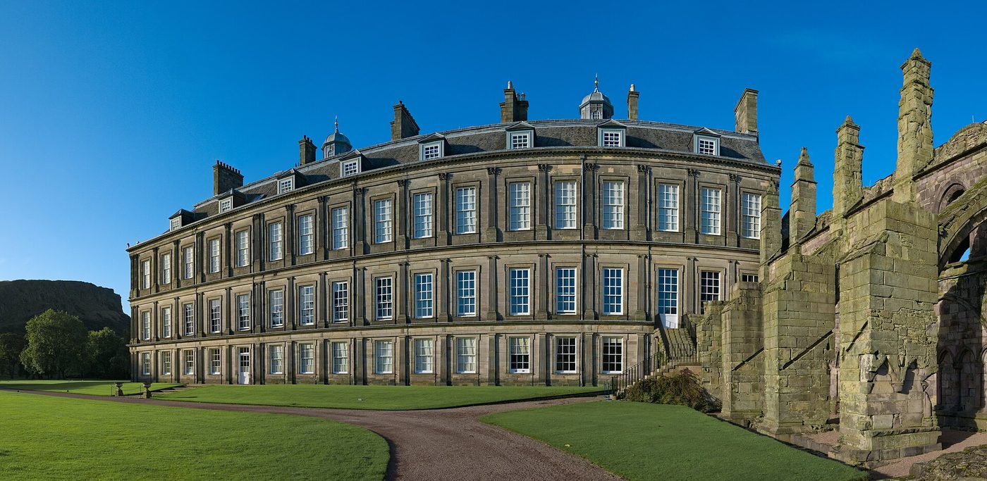 The garden front of the Palace of Holyroodhouse with the ruined abbey alongside